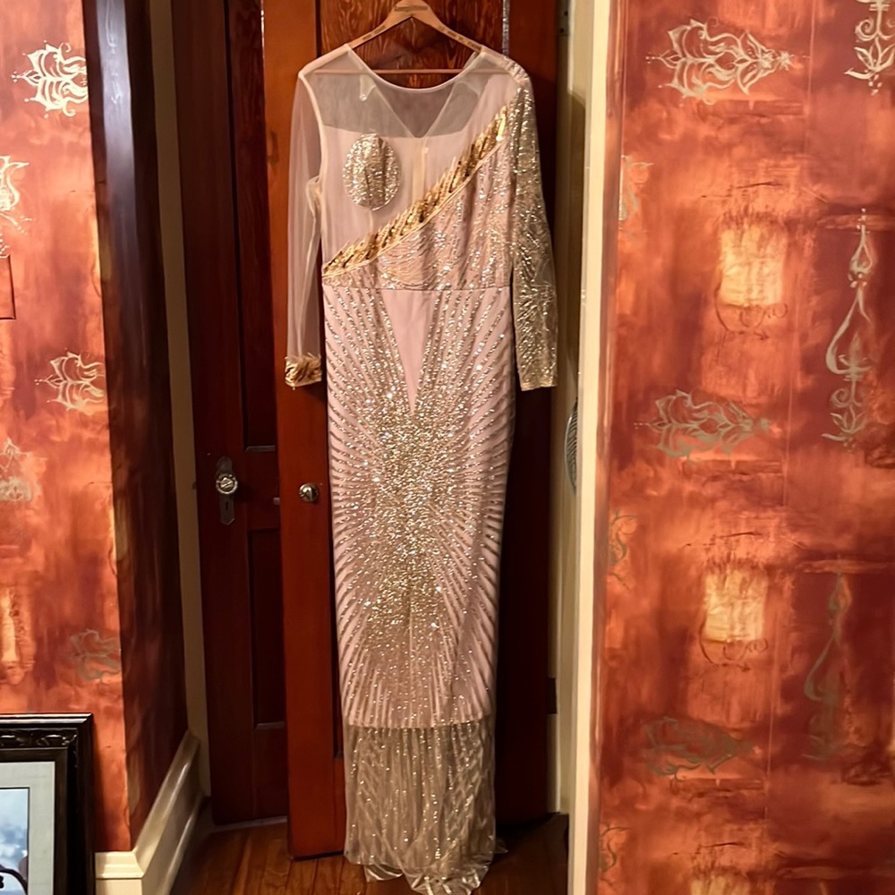 Evening gown-  Gold sequined with train in back. Netting on front and back.